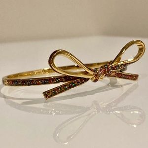 Kate Spade Skinny Mini bow bracelet. 12k gold plate pink enamel glitter. Bangle